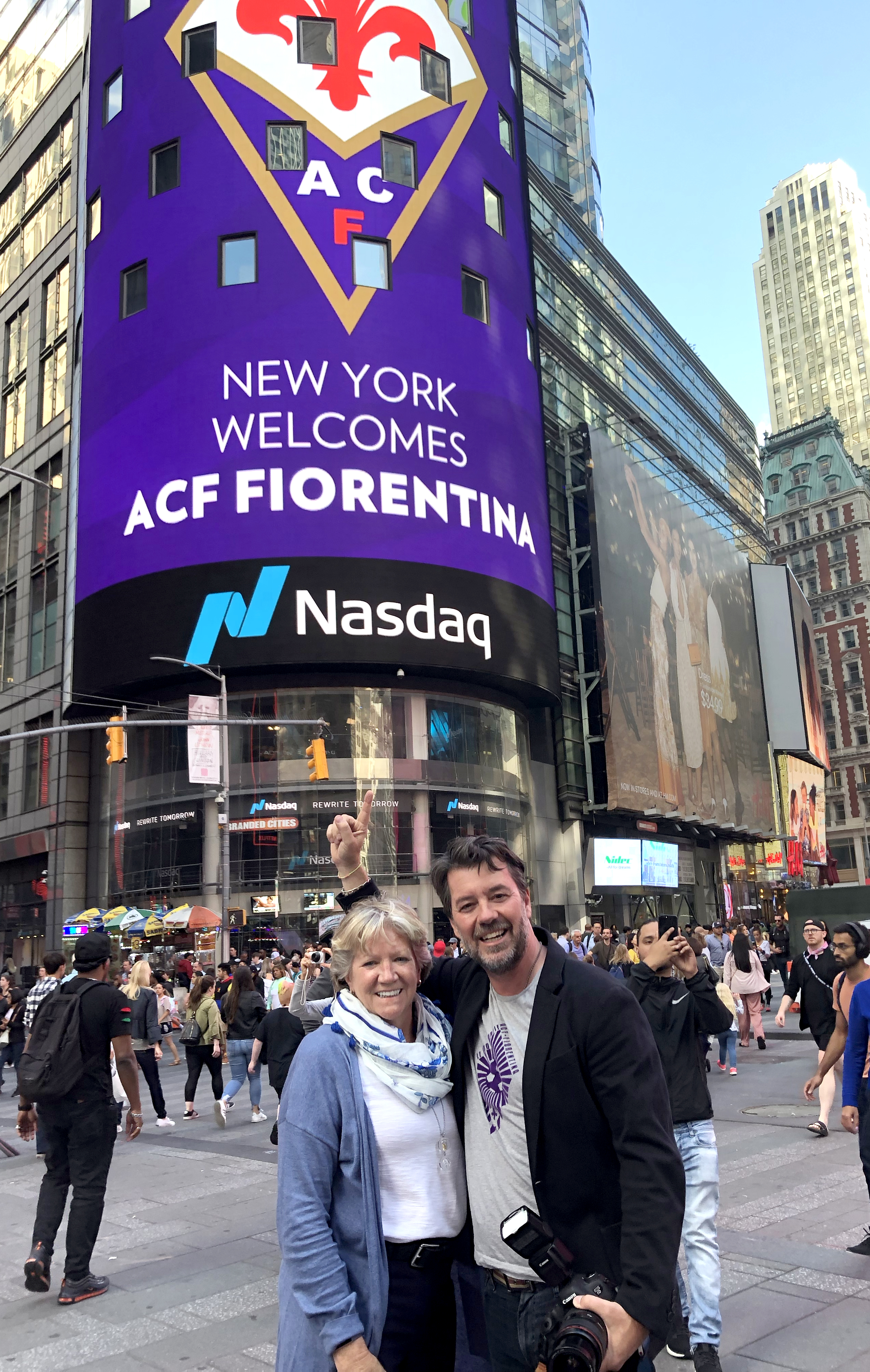 Maura and Rob show off our work on the NASDAQ video tower